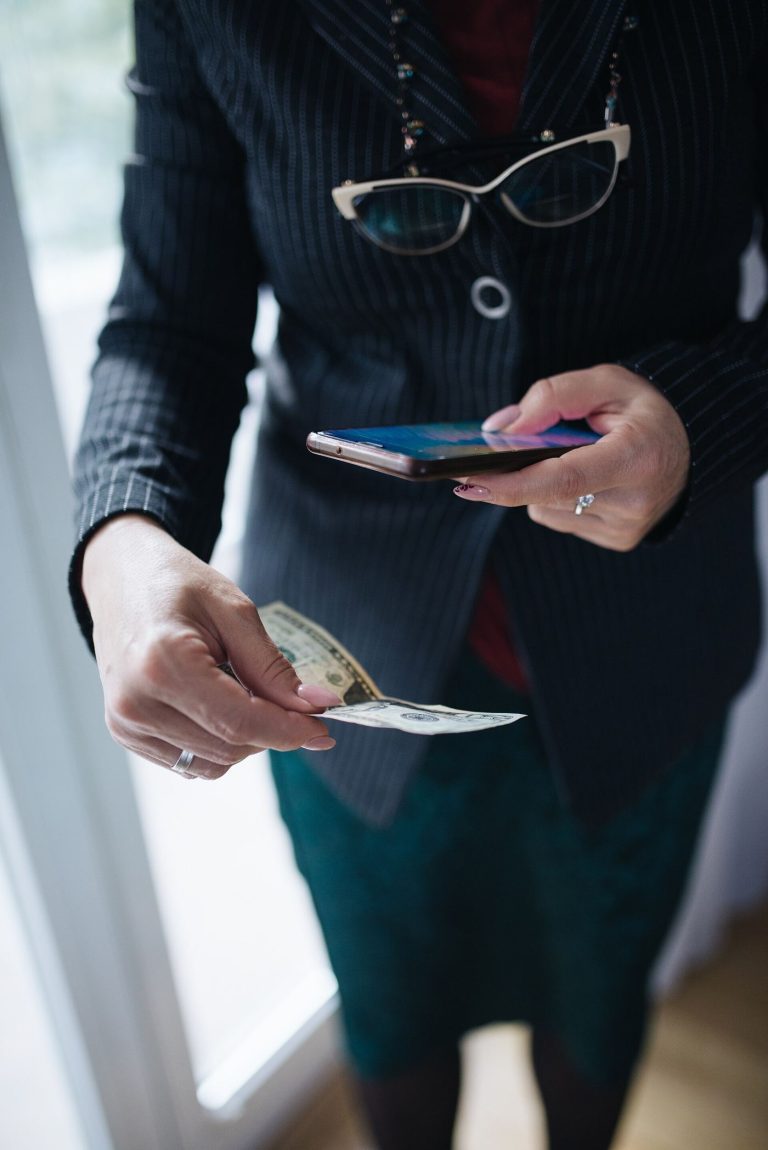 a customer paying by holding a smartphone near a terminal